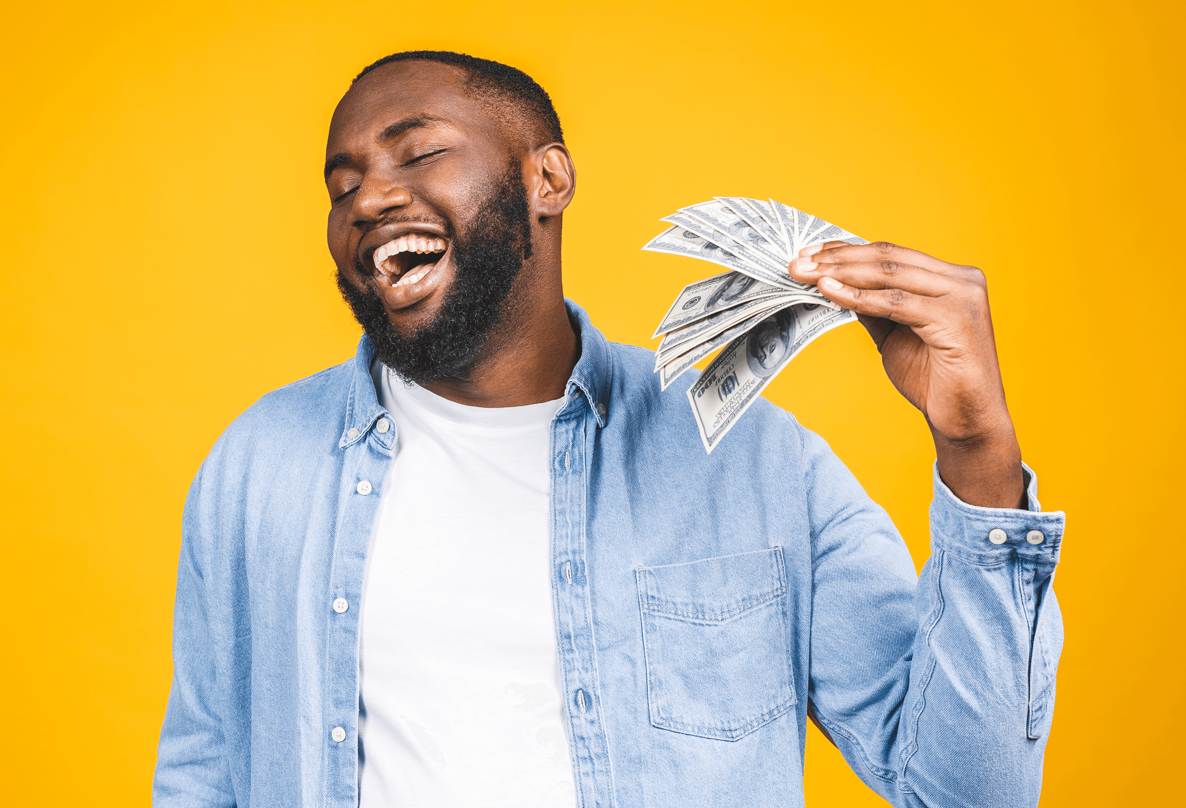 man fanning himself with money