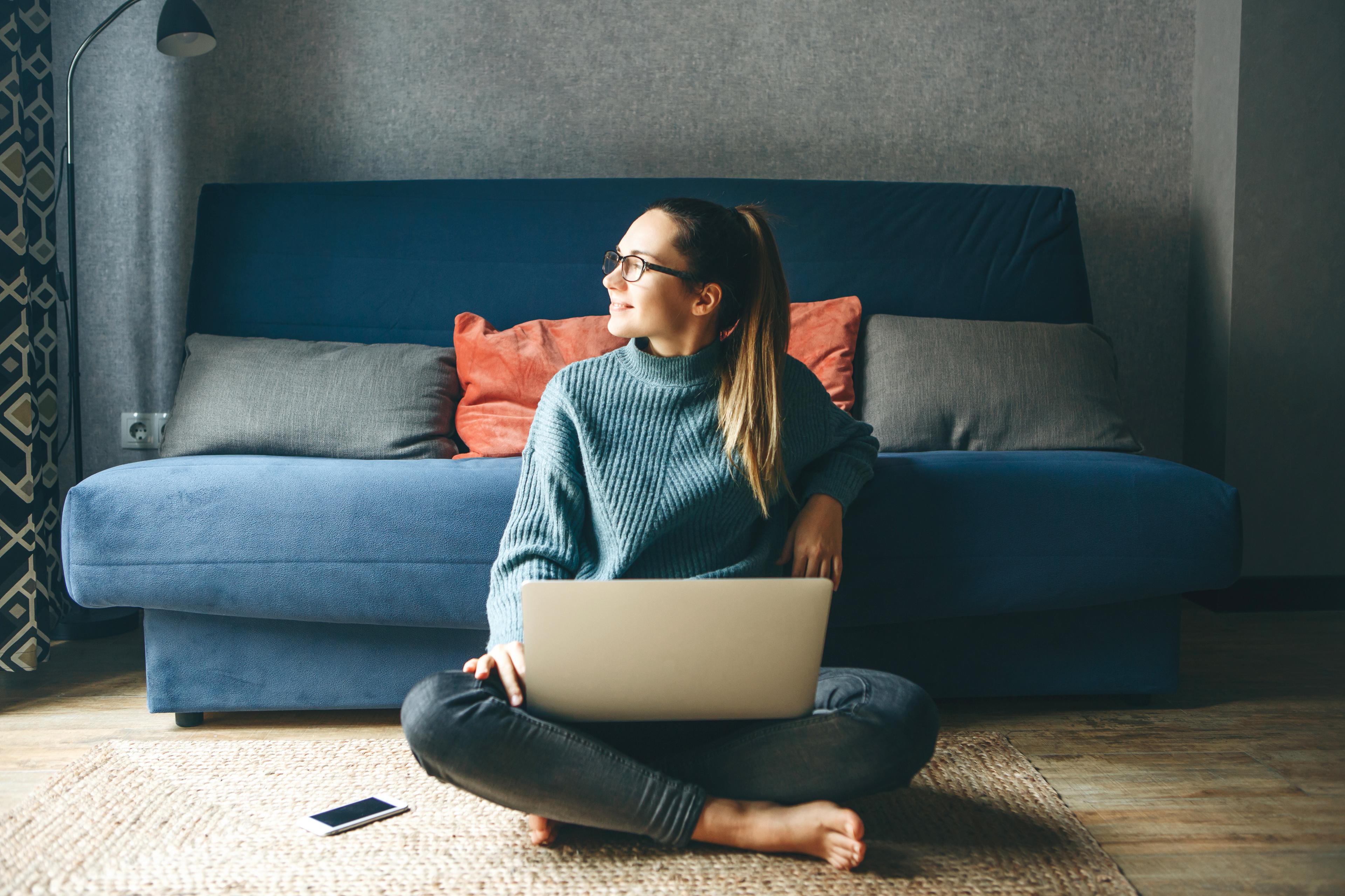 woman doing taxes on laptop