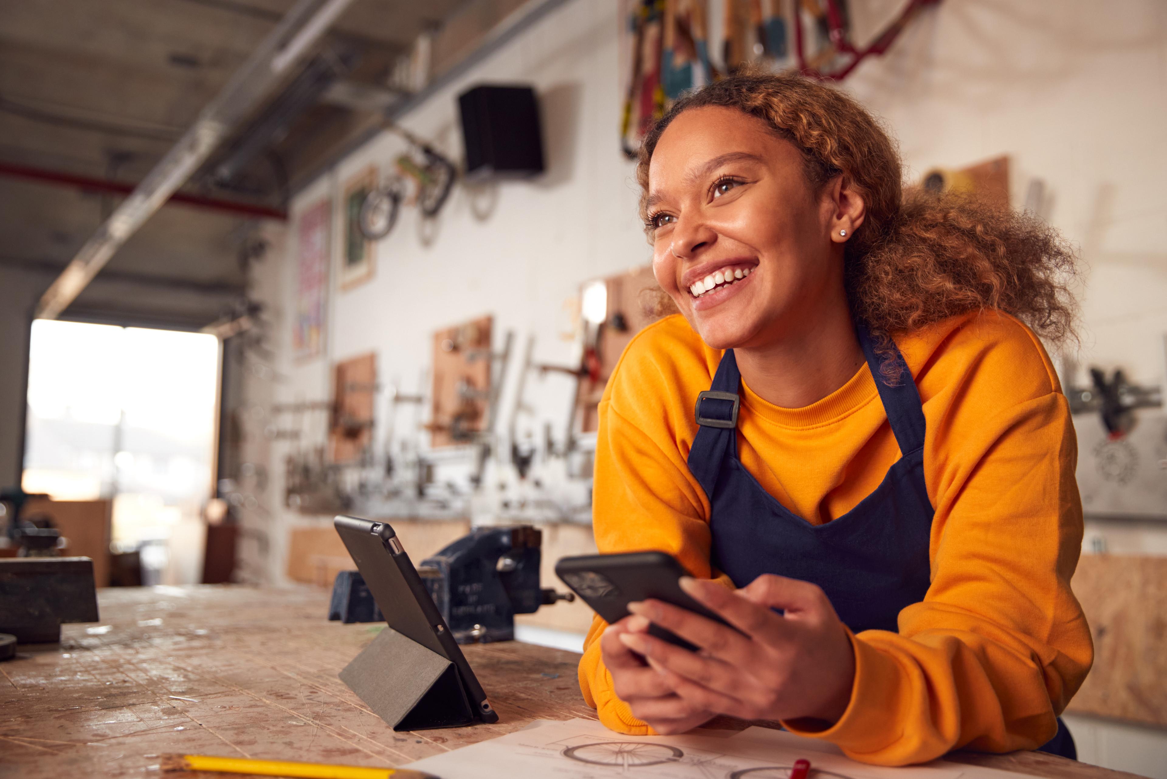 happy woman looking at phone