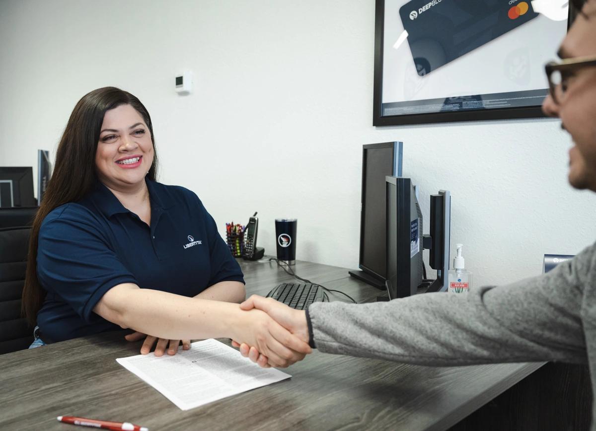 tax preparer shaking hands with customer