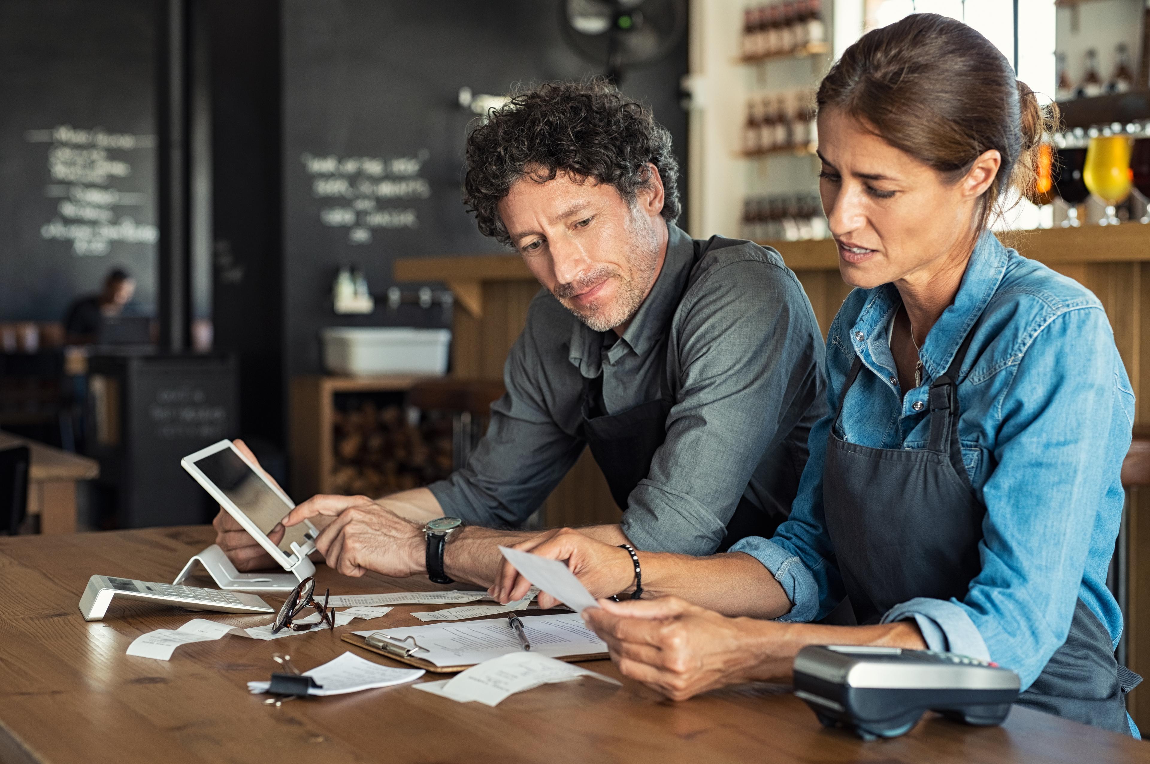 concerned couple looking at taxes