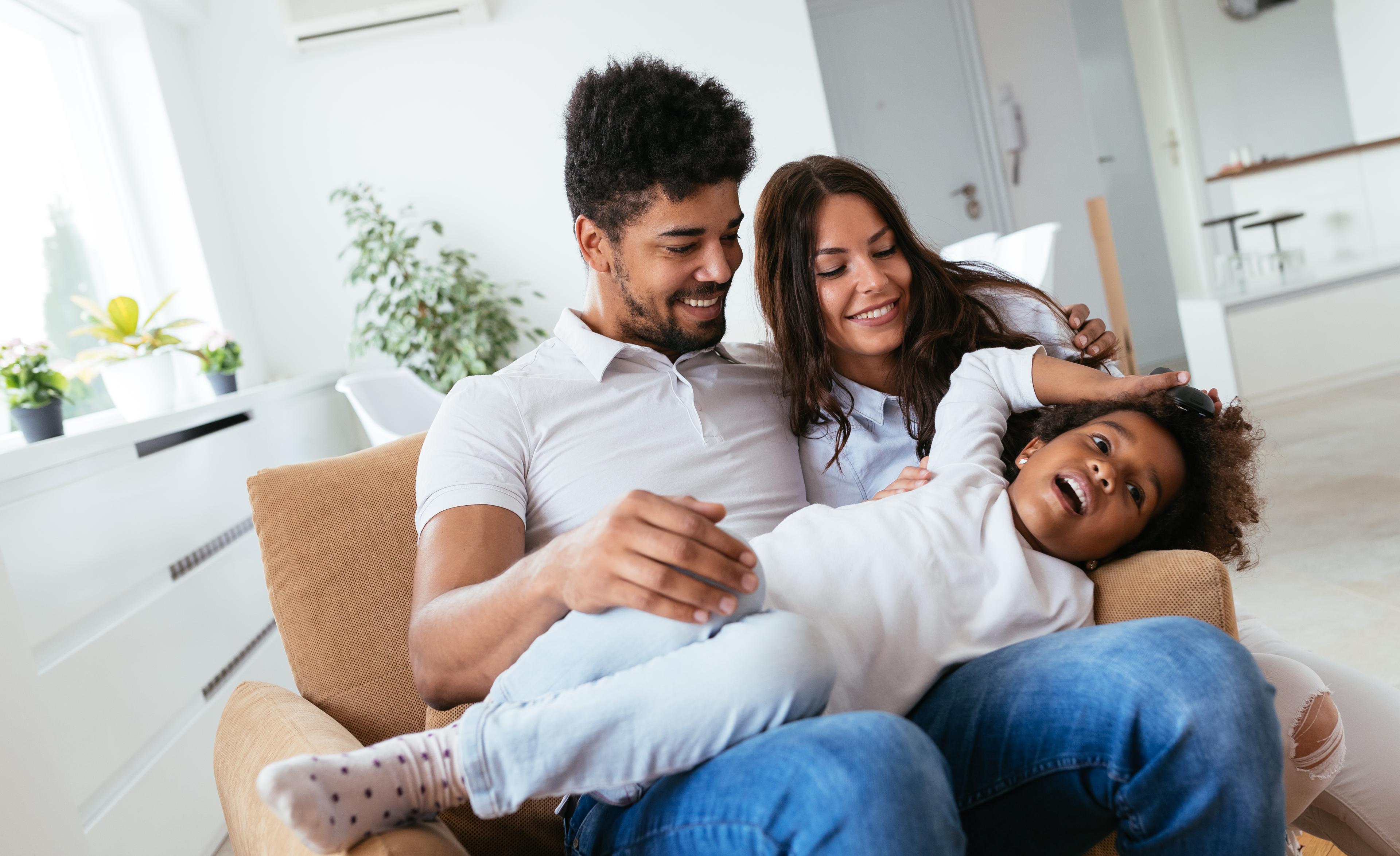 family sitting together in a chair